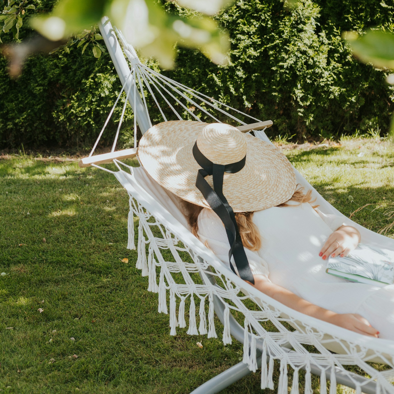 Woman resting in a hammock outdoors