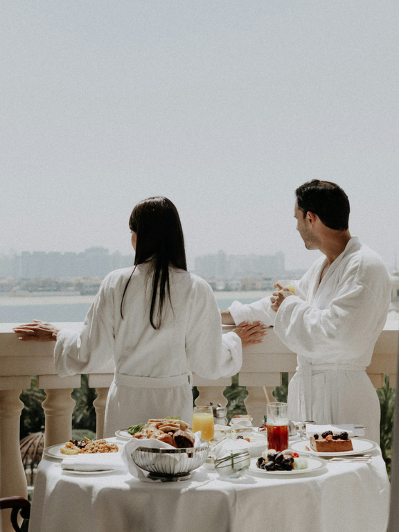 Couple admiring the view from a hotel balcony