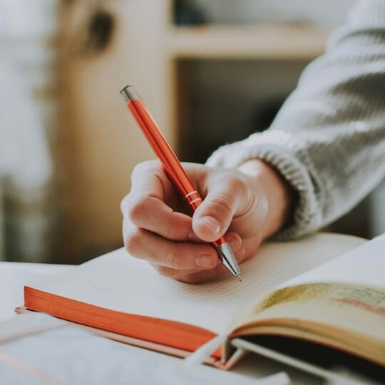 Person writing in a journal