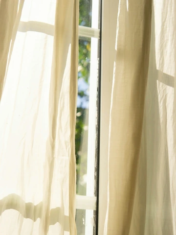 Sunlit curtains on a summer day