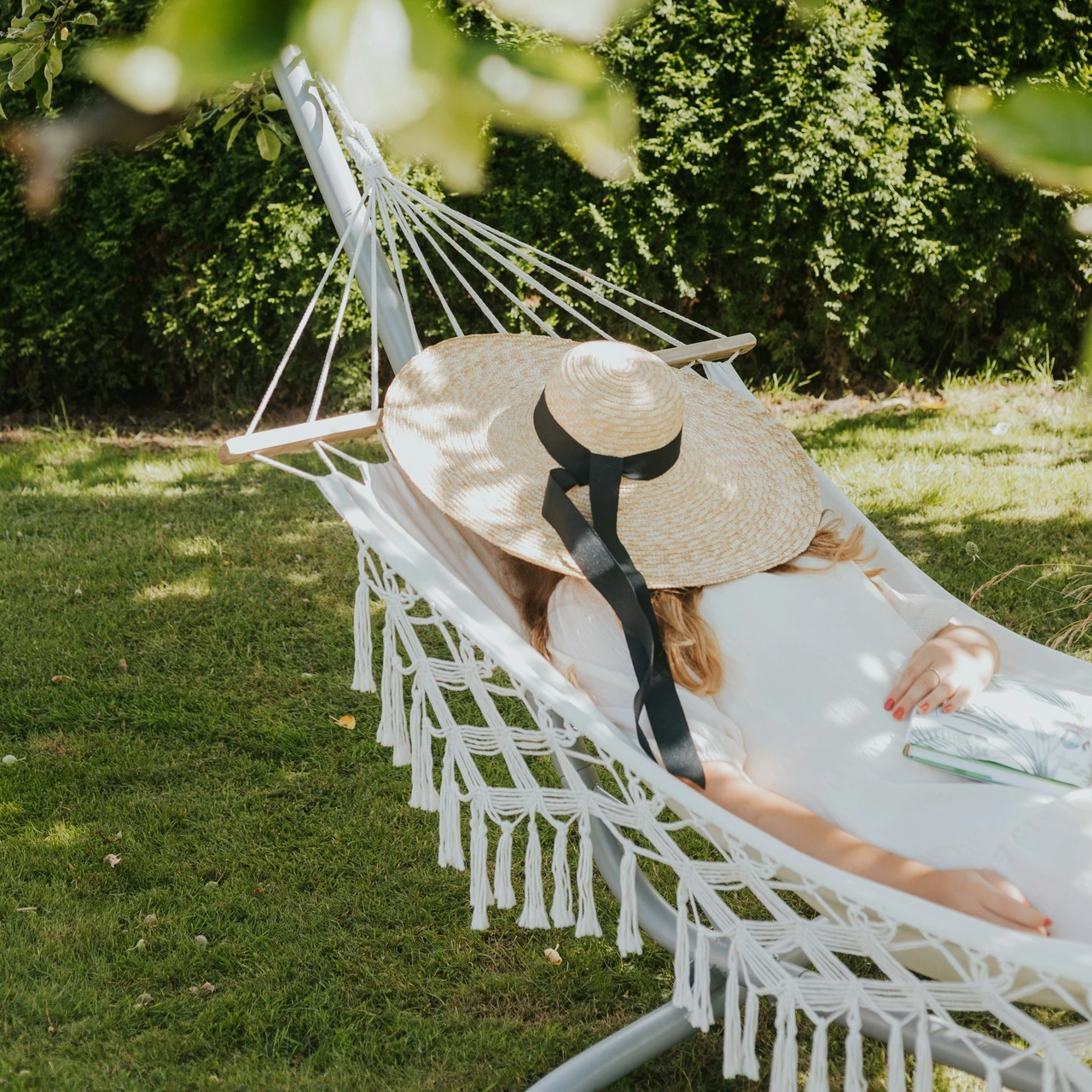 Woman resting in a hammock outdoors